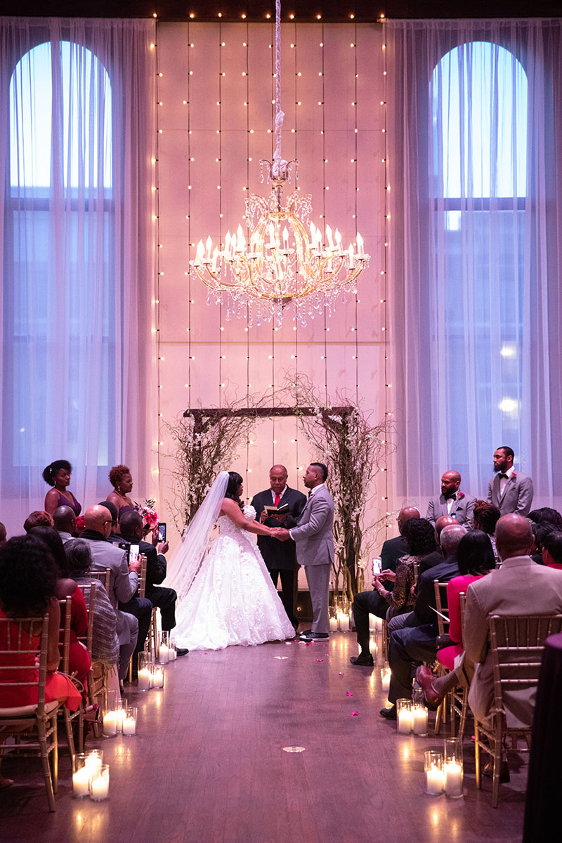 Wedding ceremony setup with string light wall