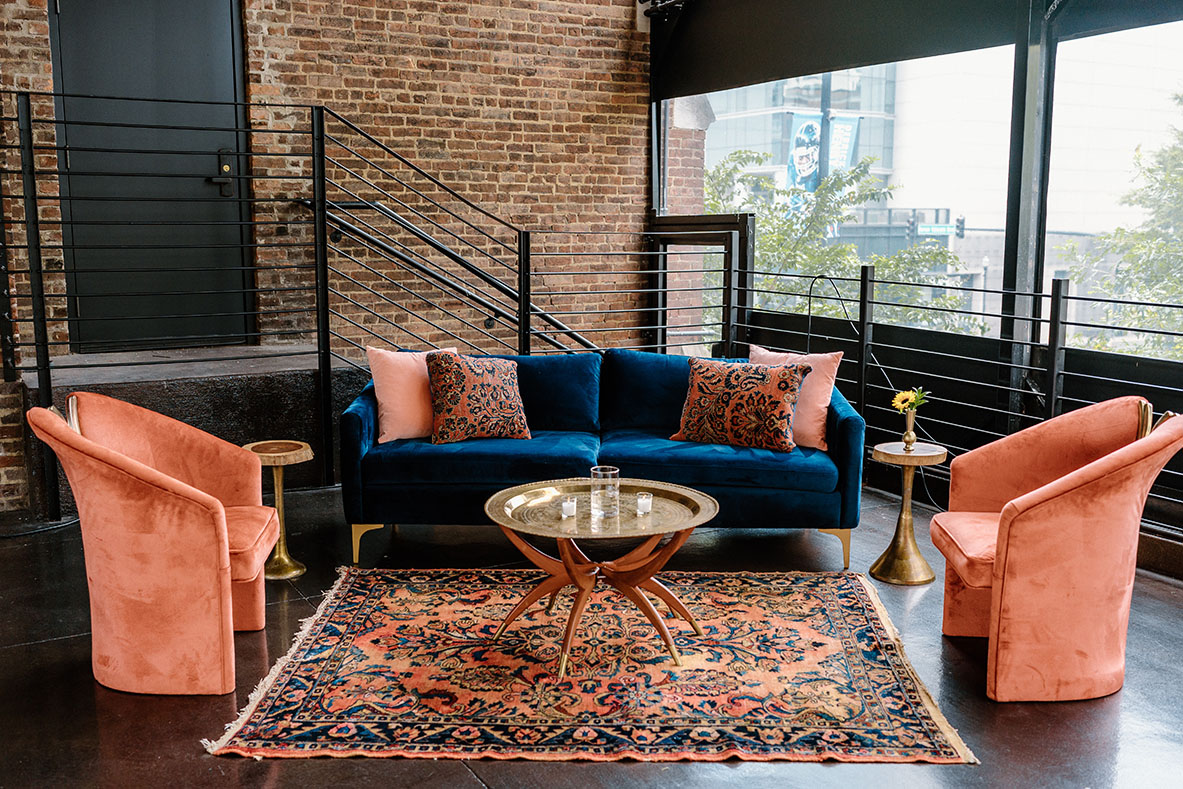 boho velvet blue and pink lounge furniture with colorful rug