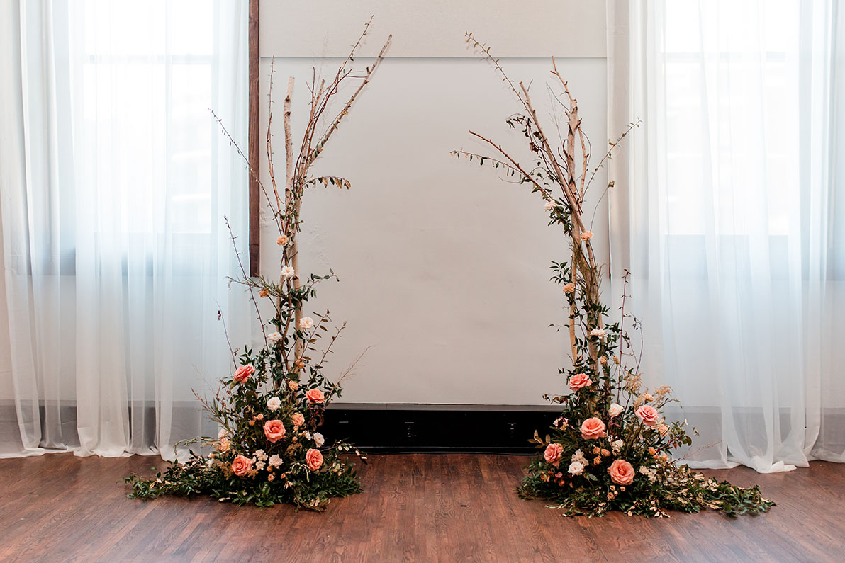 tree branch asymmetrical arch with terracotta and rust florals
