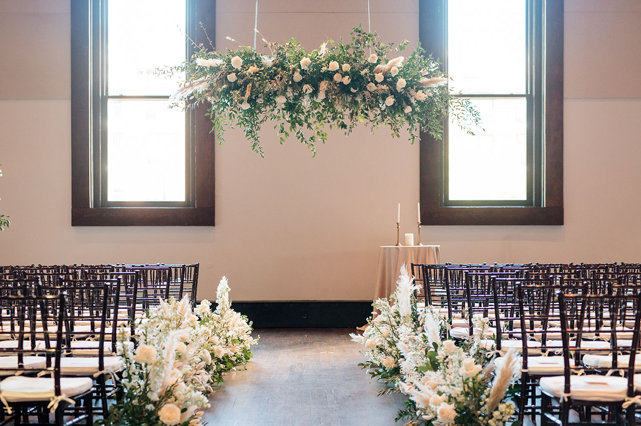 ceremony with boho florals with pampas