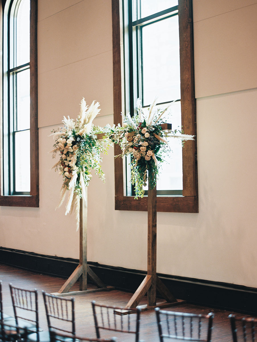 wooden ceremony arch with pampas