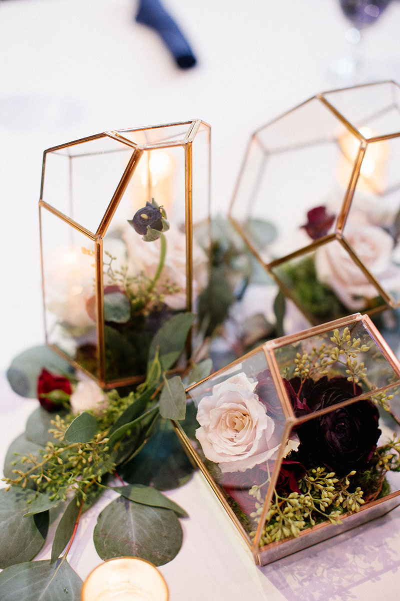 geometric centerpieces with rose florals and greenery