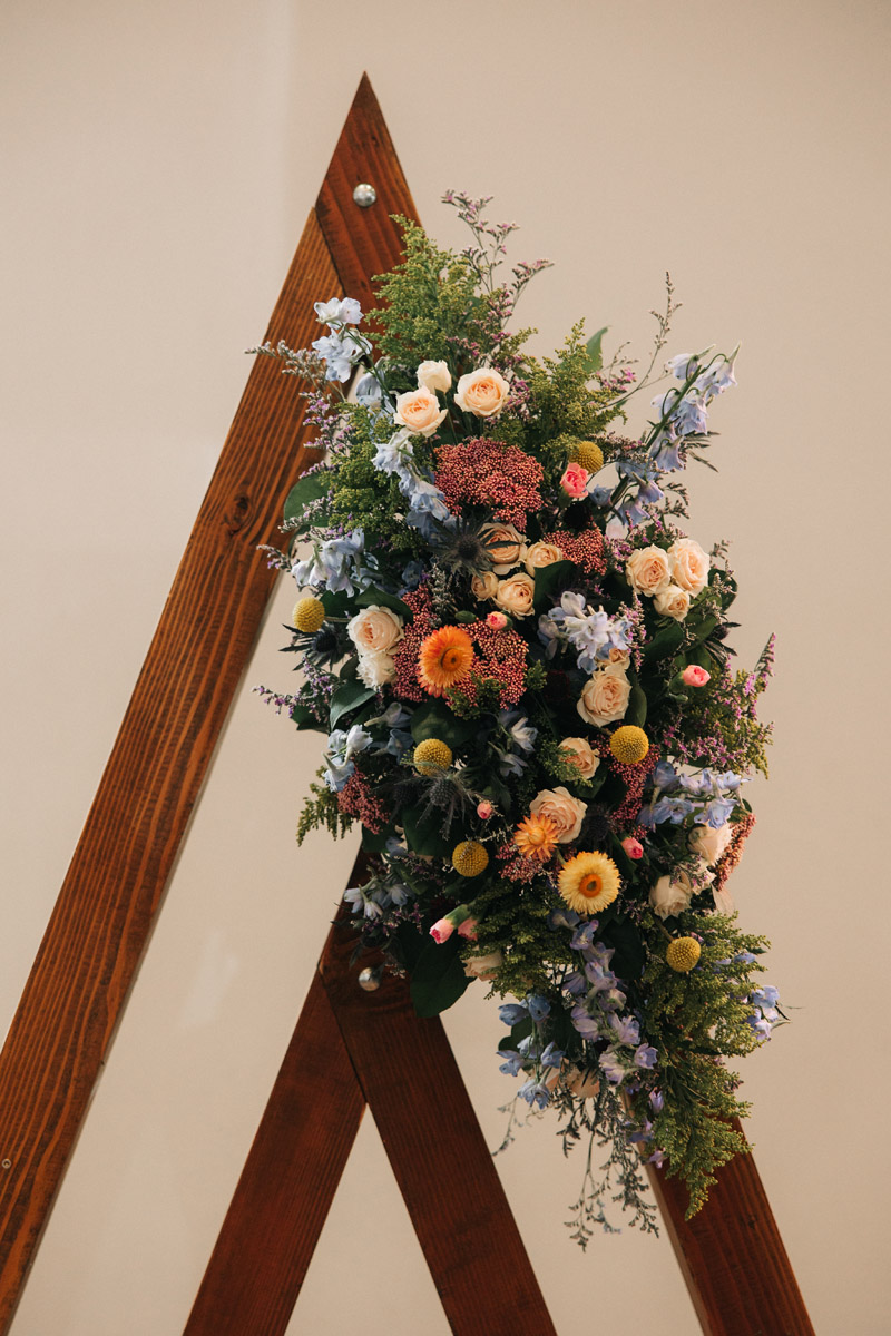 geometric ceremony arch with florals