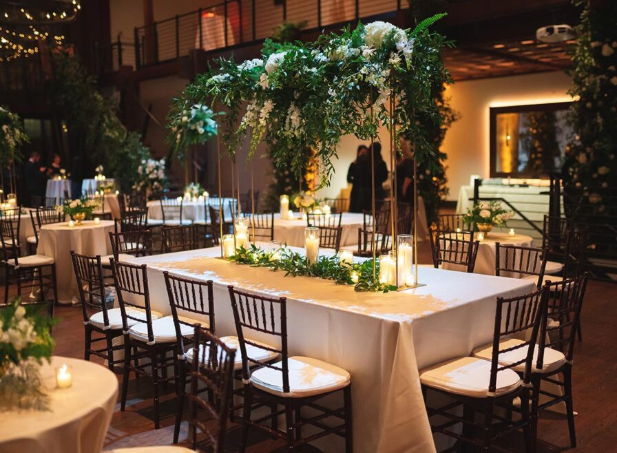 Garden-inspired wedding reception setup at the Bell Tower with greenery