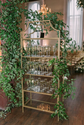 Gold champagne shelf decorated with greenery
